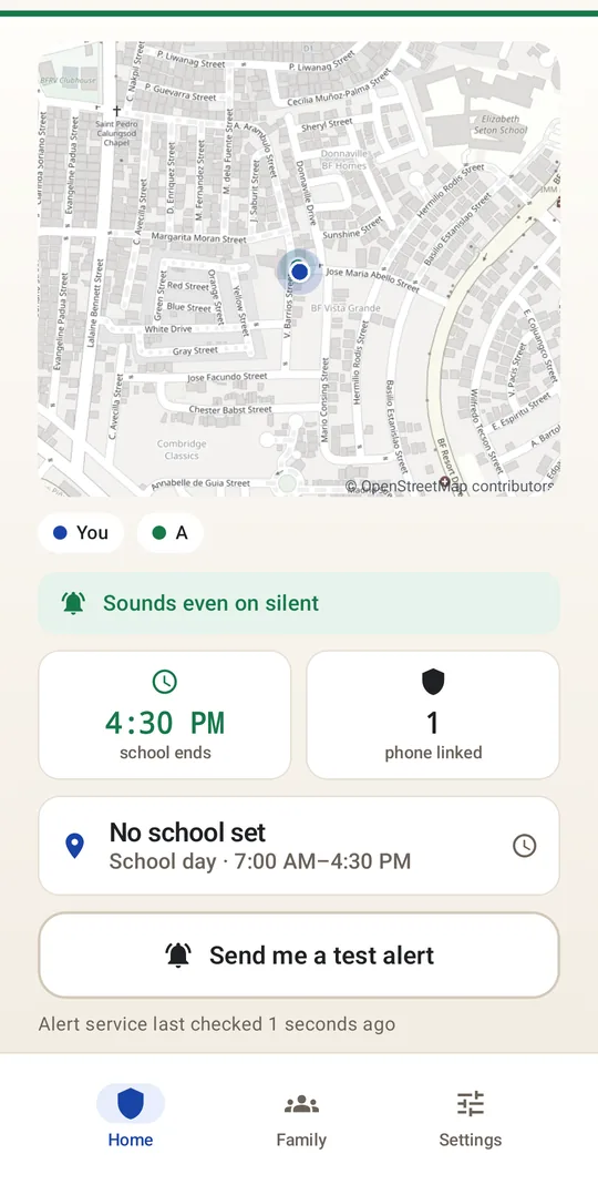 A guardian's home screen: a live map of the school, presence chips for the guardian and their child, and a button to send a test alert.